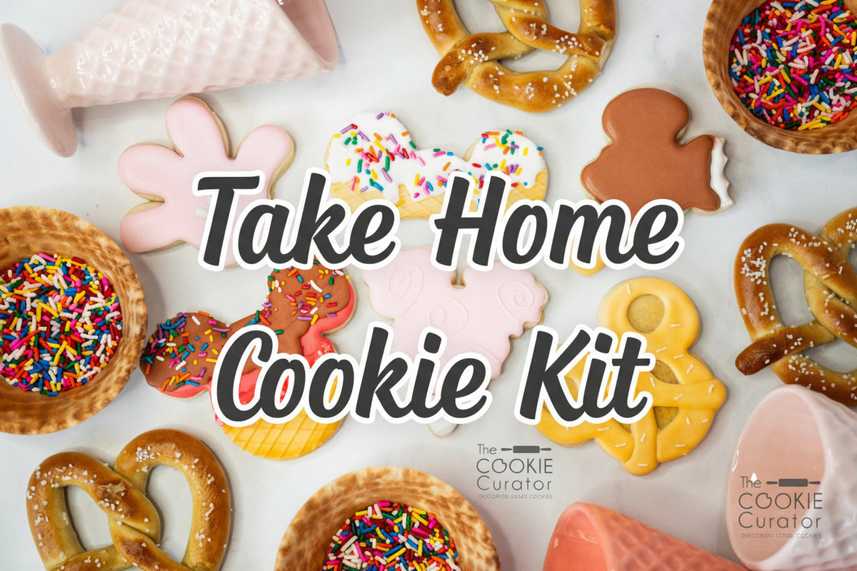 A variety of decorated cookies in shapes of characters, sprinkles, and other thematic elements, likely made with the help of a cookie decorating kit.